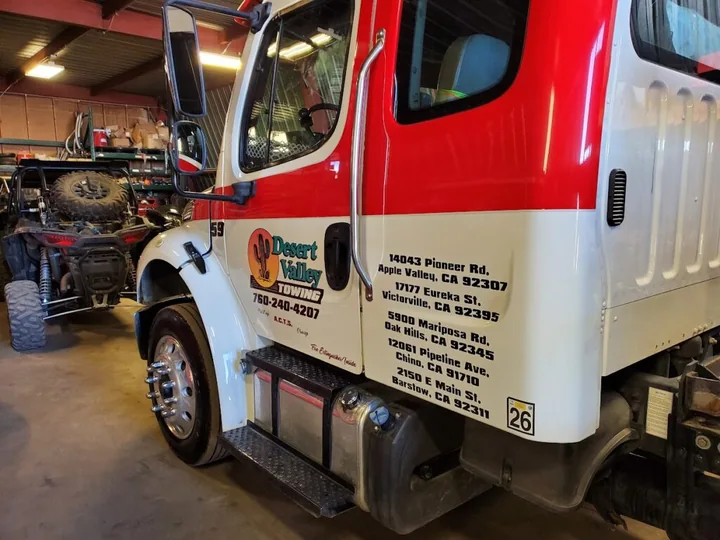 Desert Valley Towing branded truck cab